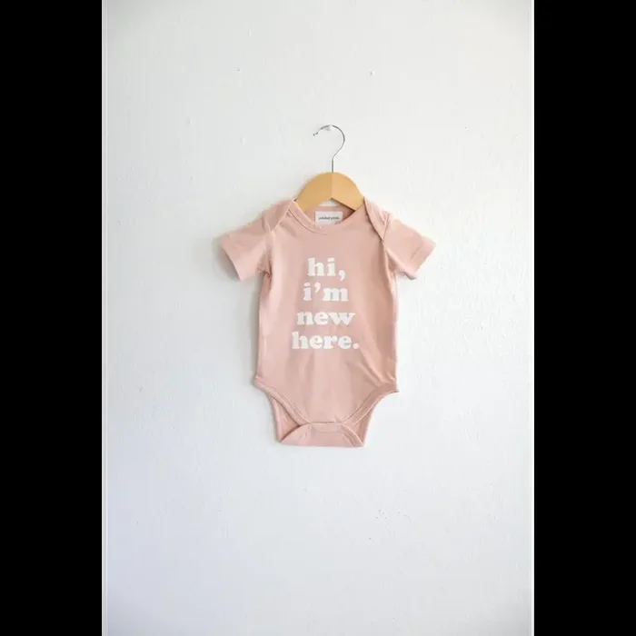 Hi, I’m New Here in Rose Organic Cotton Baby Onesie